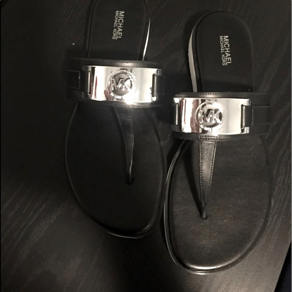 Authentic NWTS Michael Kors thong style sandals with beautiful silver accents